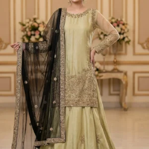 Model wearing an Olive Gold Heritage Farshi Lehnga set with hand-made Zari work and black dupatta