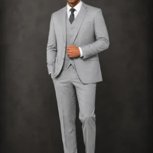A gentleman wearing the "Slate Sovereign" premium three-piece suit, showcasing sharp tailoring and refined surface ornamentation as seen in 111.webp, 222.webp, 333.webp, and 444.webp.