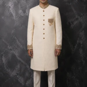 A groom wearing the ivory Sadaf-e-Noor bespoke sherwani featuring intricate metallic thread detailing as seen in 2.jpg, 3_2.jpg, 4.jpg, and Untitled-1.jpg.