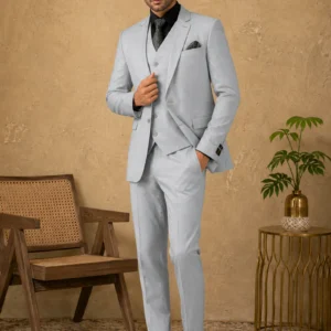 A gentleman wearing the "Sterling Mist" premium three-piece suit in #b1bcc6 color, showcasing sharp tailoring and refined hand-made Zari work surface ornamentation as seen in 444_3.jpg, 555_3.jpg, 666_3.webp, and 777_3.webp.