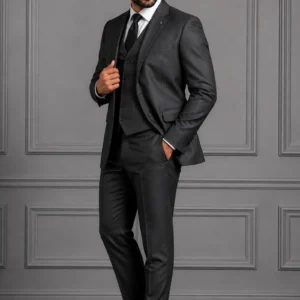 A man wearing the "Midnight Charcoal" premium three-piece suit, showcasing sharp tailoring and refined surface ornamentation in 88.webp, 99.webp, 100.webp, and 1001.webp