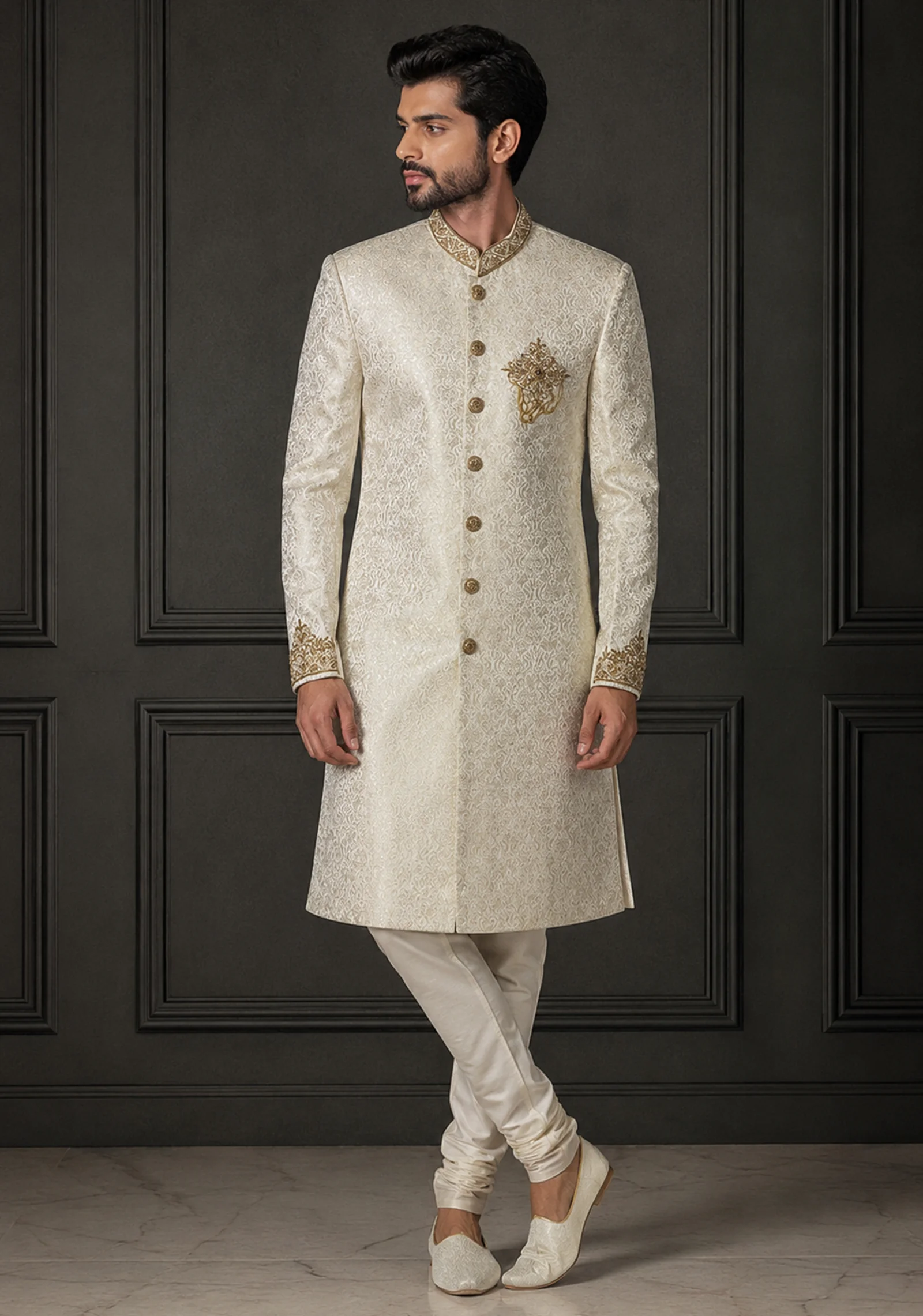 : A gentleman wearing the "Ivory Sovereign Heritage" premium sherwani, showcasing sharp tailoring and refined Zari work surface ornamentation as seen in 9.webp, 10.webp, 11.jpg, and 12.jpg.