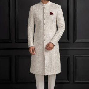 Model wearing the Almas-e-Hisaar ivory bespoke Sherwani featuring a geometric diamond grid and metallic thread detailing.