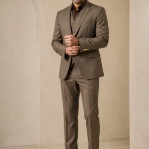 "The Regal Heritage" earthy brown premium three-piece suit pehne huye, jisme uski sharp tailoring aur formal look saaf dikh rahi hai.