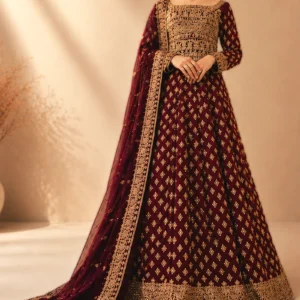 A bride wearing a premium Royal Crimson Zari Heritage Farshi Lehnga with intricate hand-made Zari work.