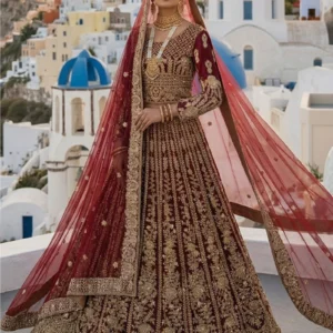 Traditional red bridal lehenga with golden zari handwork and farshi flare.