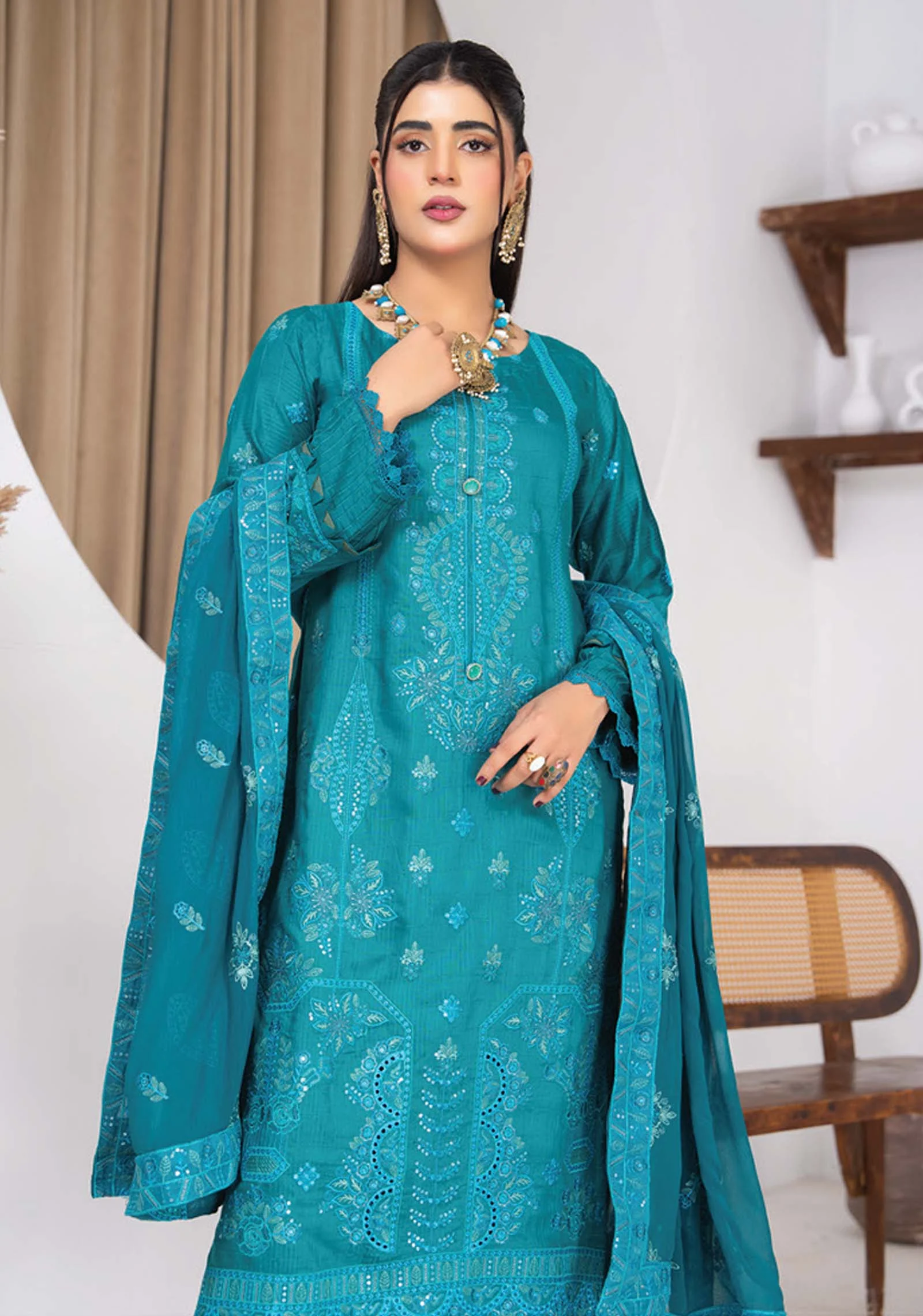 Close up of embroidery and zari strips on AL Hassan Lehnga House suit