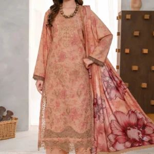Woman wearing a peach digital printed Karandi suit with aplic work and lace dupatta.