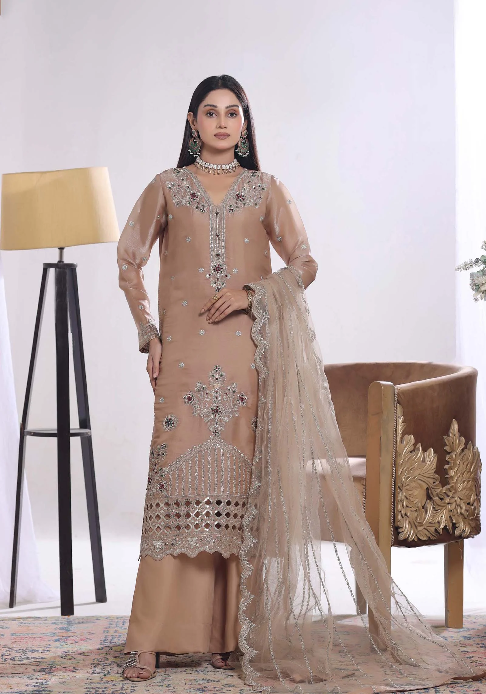 Woman wearing a sand colored sheesha silk formal suit with palazzo pants by AL Hassan Lehnga House