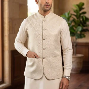 Front view of a man wearing a cream textured jacquard waistcoat with gold diamond patterns by AL Hassan Lehnga House