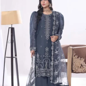 Woman wearing a midnight blue silk formal suit with silver threadwork by AL Hassan Lehnga House