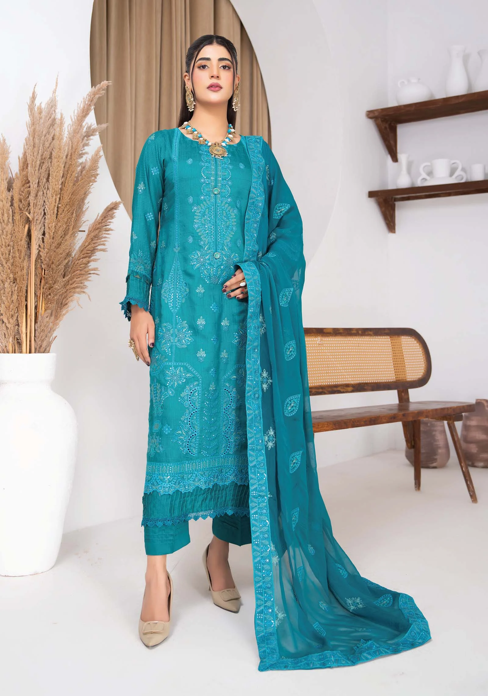 Front view of Noor-e-Firoza teal embroidered viscose 3pc suit
