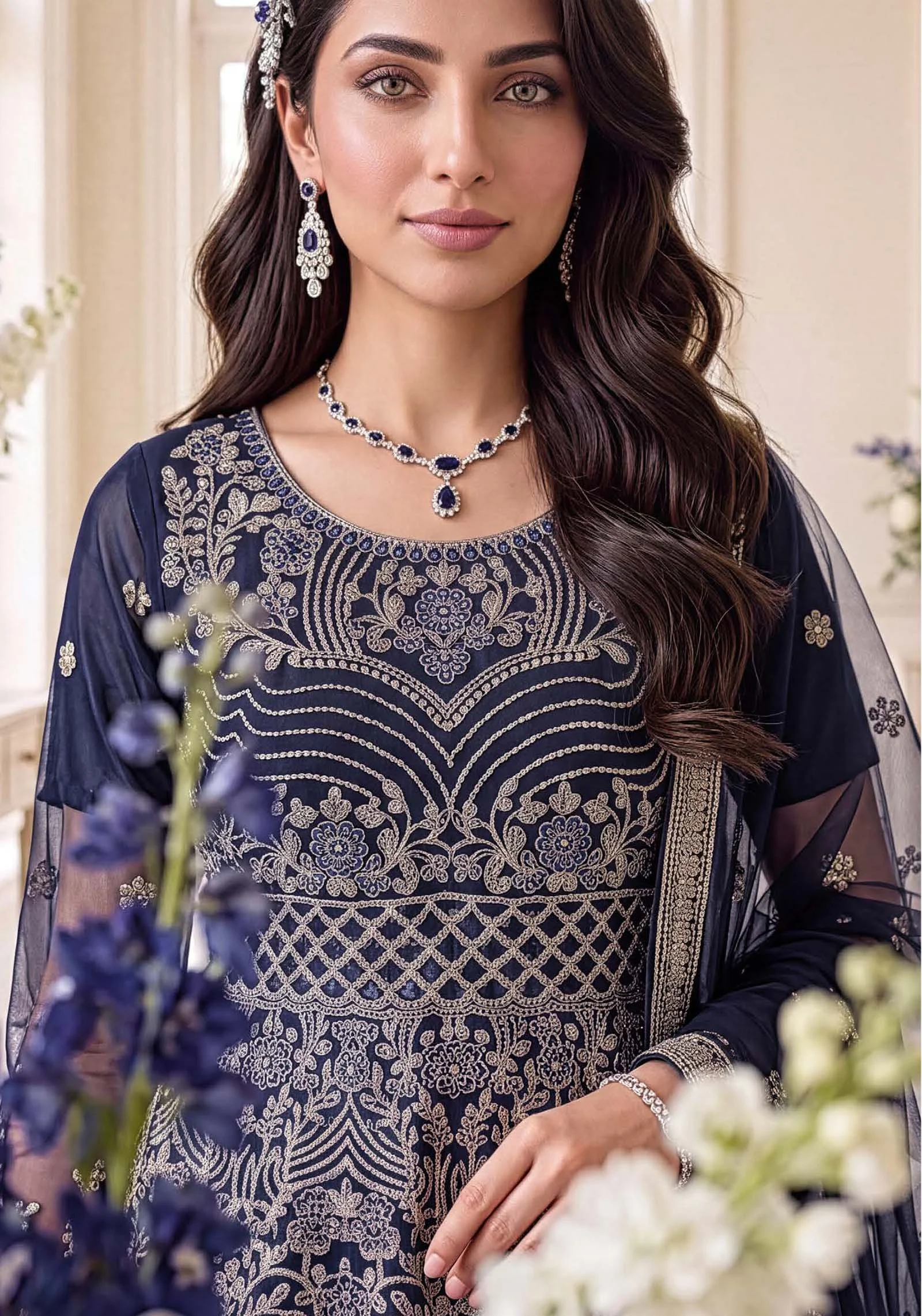 Close up of the intricate zari and jewellery material on the neck of the Zoya navy peplum